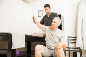 A professional performing a massage on an employee.