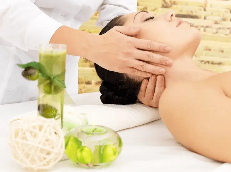 A therapist providing a relaxing neck massage to a client.