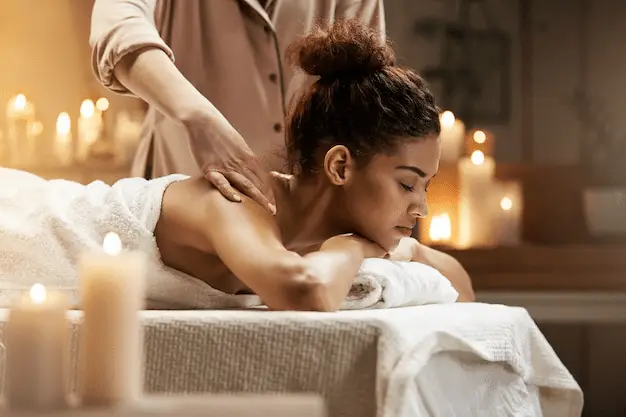 a woman lying on a massage table