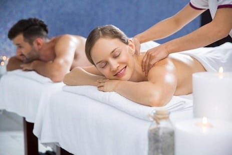a couple receiving massage therapy