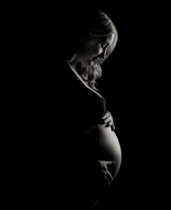A pregnant woman.