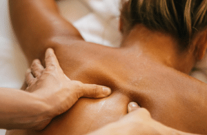 A woman getting a deep tissue massage.
