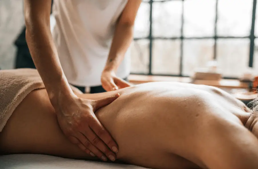 A person getting a deep tissue massage for recovery.