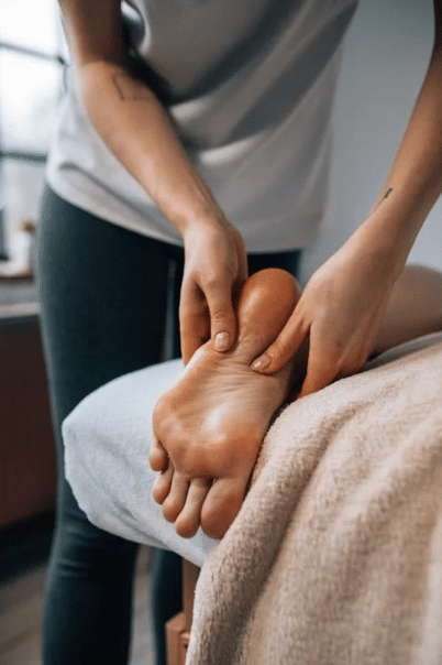 A person enjoying a relaxing and therapeutic foot massage.