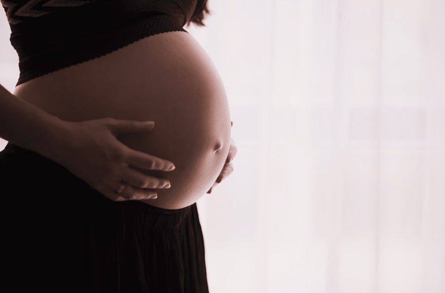 A pregnant woman ready for prenatal massage.