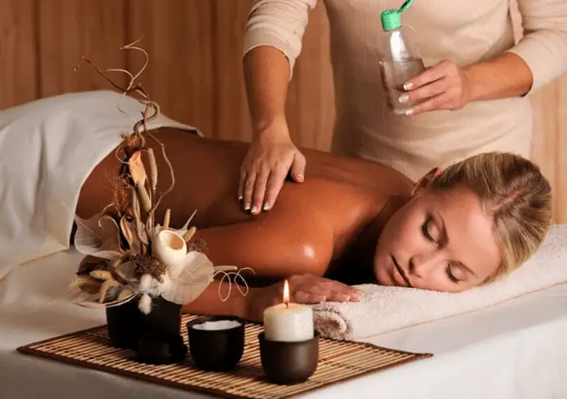 A picture of a person getting a therapeutic oil massage