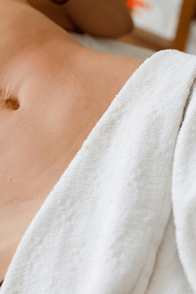 woman receiving a body contouring massage at a spa