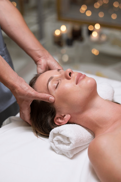hands massaging scalp with focus on hair roots