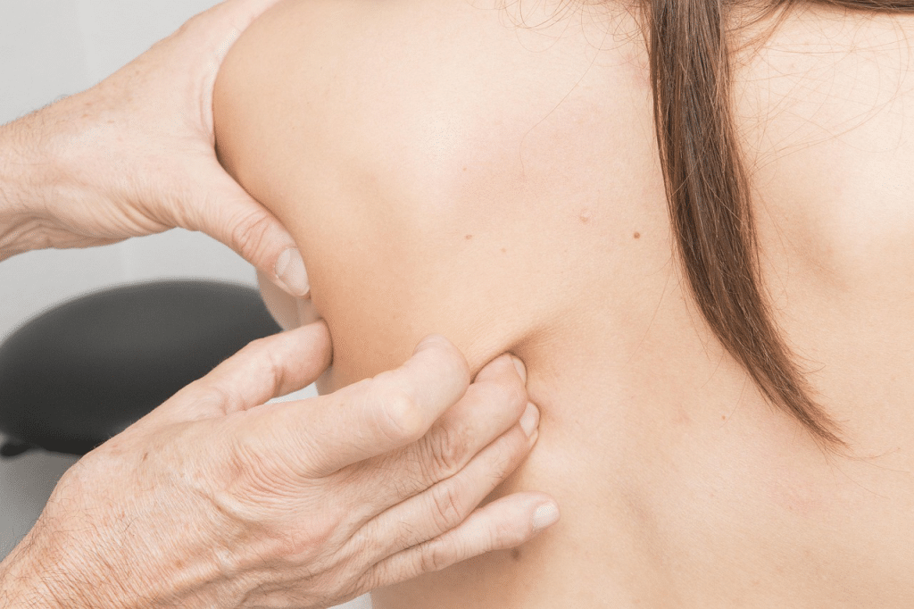 A woman enjoying a soothing back massage.