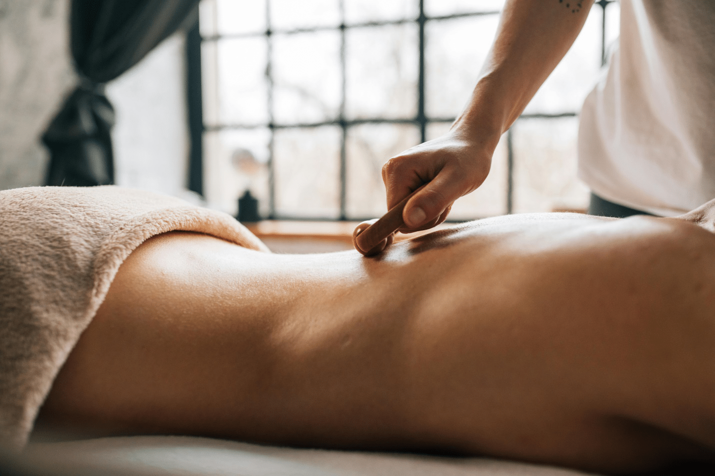 A person giving a full body massage