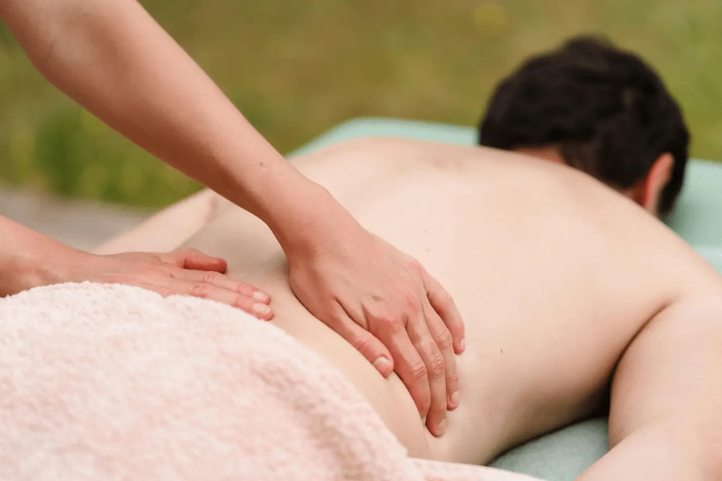A person giving a full body massage