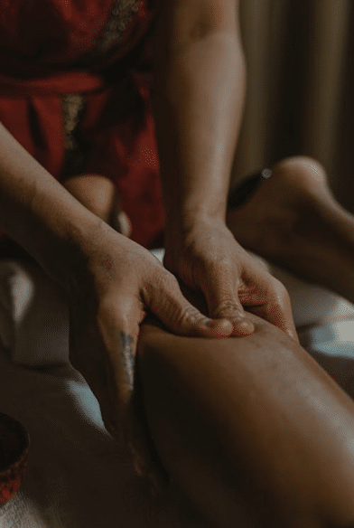 person's leg while getting a leg massage